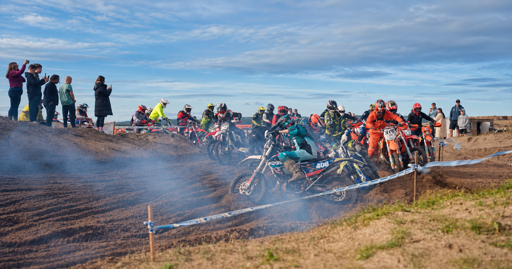 Riders racing through sand and smoke at the 2025 Tain Hare and Hounds event