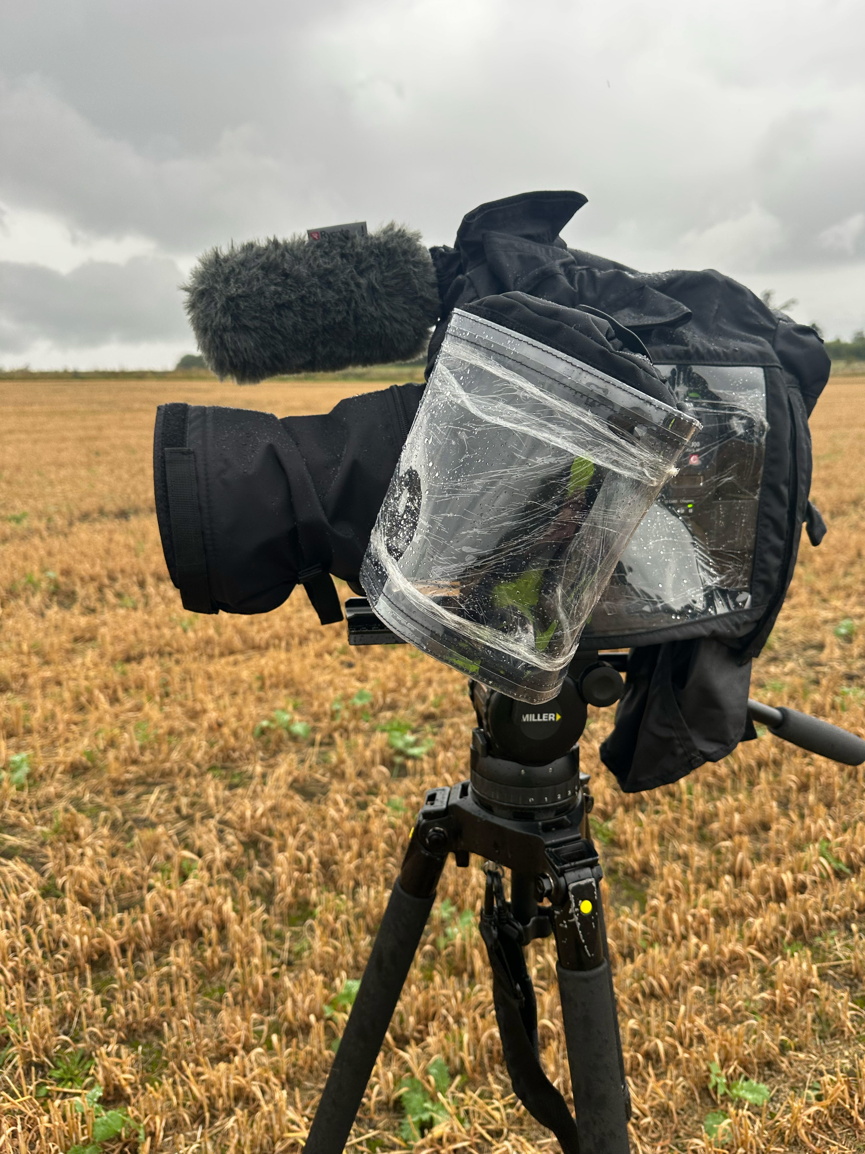 Rain cover protecting cinema camera equipment during Wooler Timecard Enduro